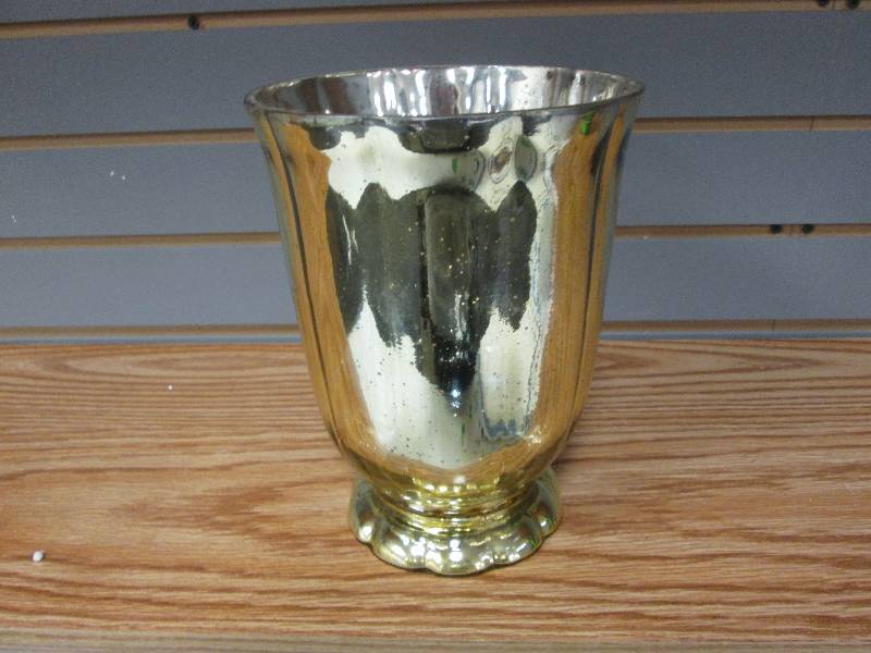 8 12 inch gold toned pillar candle...