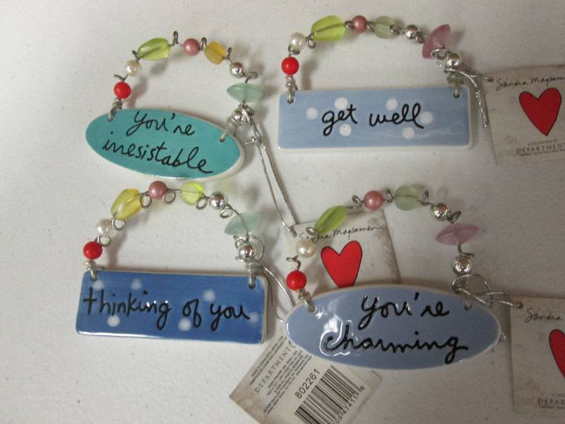 Lot of 4 assorted charm tiles...