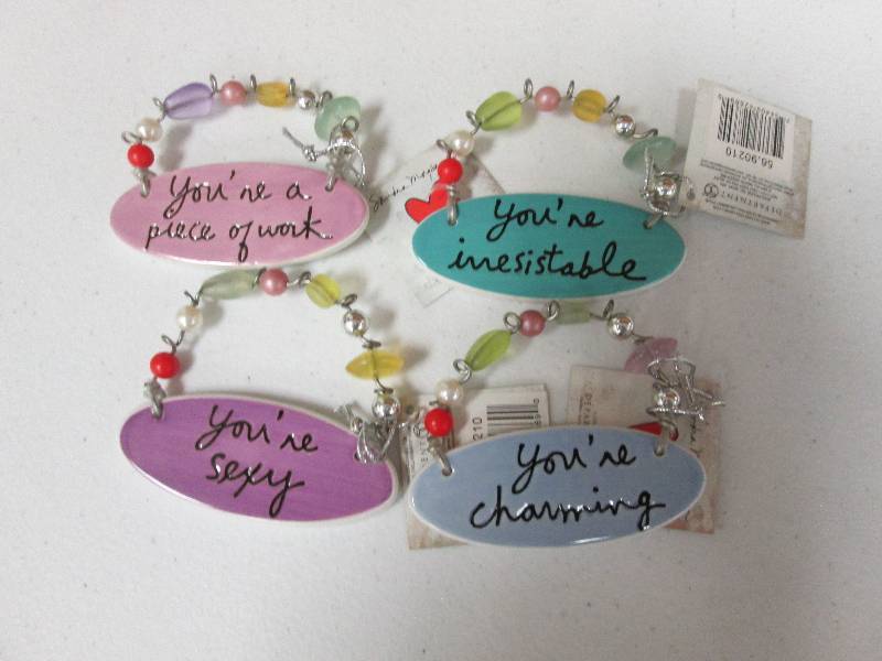 Lot of 4 assorted charm tiles...