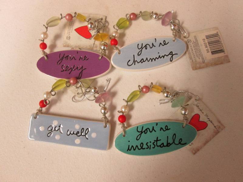 Lot of 4 assorted charm tiles...