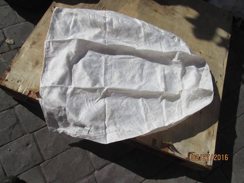 Bag of half oval shaped linen pillo...