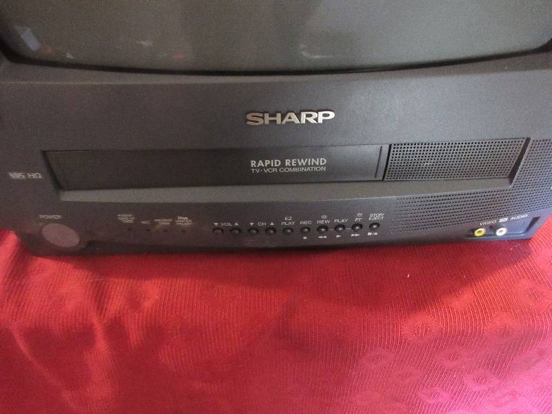 11 INCH SHARP TV AND VCR AND REMOTE