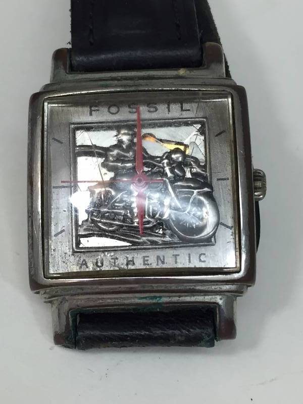 lot 85 image: Fossil Watch in original Tin - motorcyclist