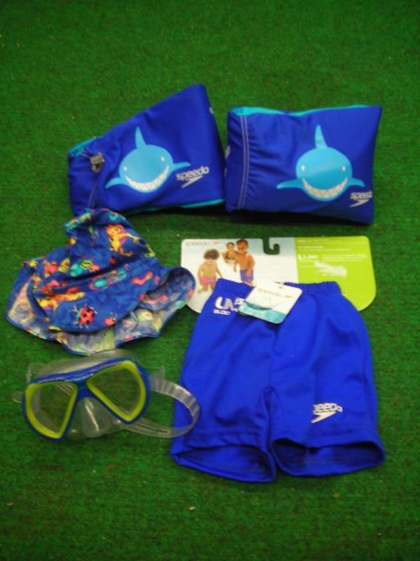 lot 13 image: Swimming Gear (some new with tags) Trunks, Wings, Hat, Face Mask