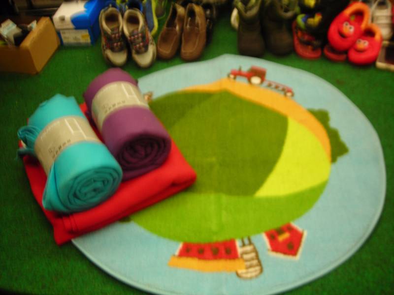 lot 34 image: IKEA Rug With Tractor, 3-NEW Fleece Blankets