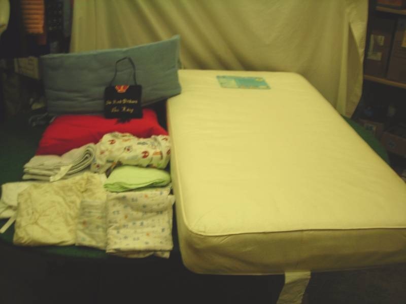 lot 79 image: Crib Mattress, Bumper Pad, Mattress Pad, Assorted Crib Sheets