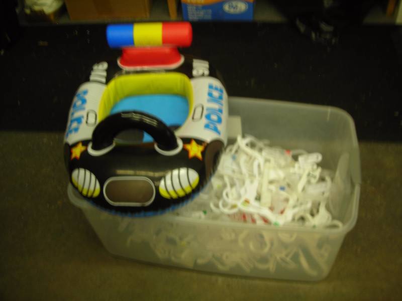 lot 80 image: Tub Of Hangers & Inflatable Police Car Floatie