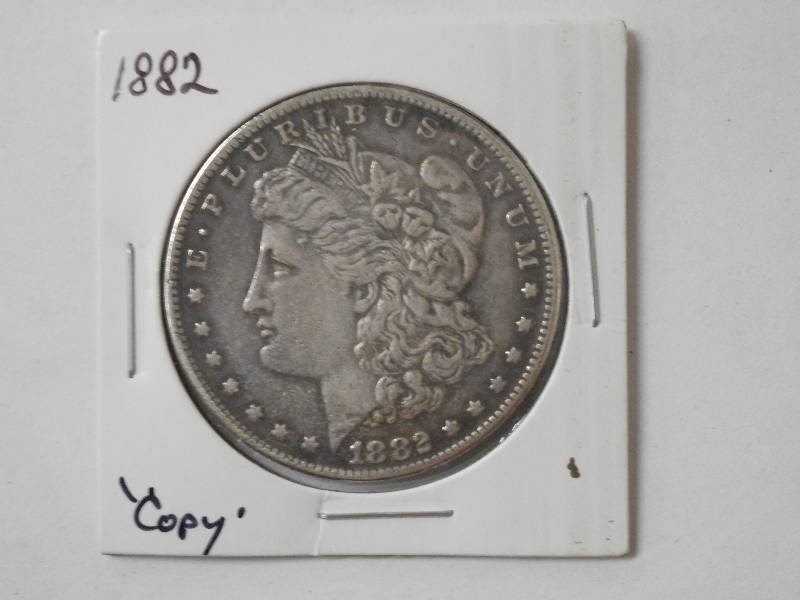 lot 114 image: 1882 Morgan Dollar - ForgeryCopy...