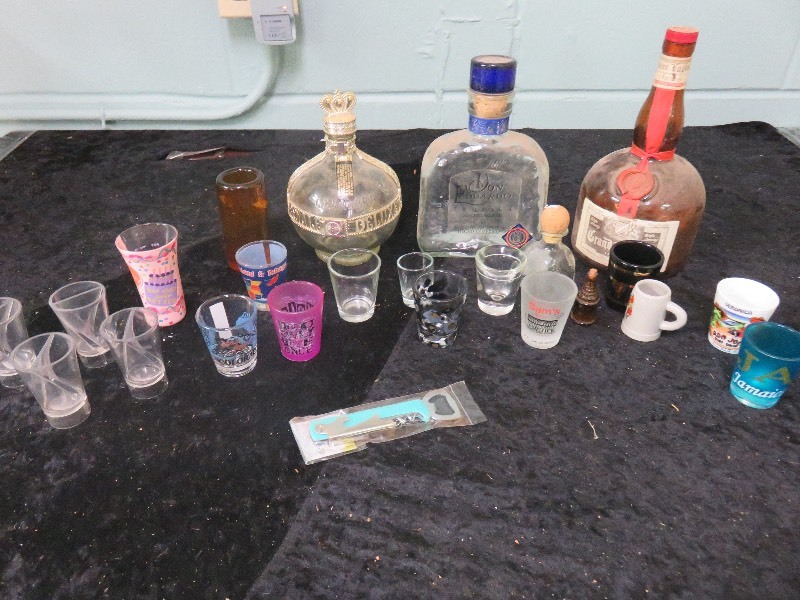 Empty bottles and shot glasses