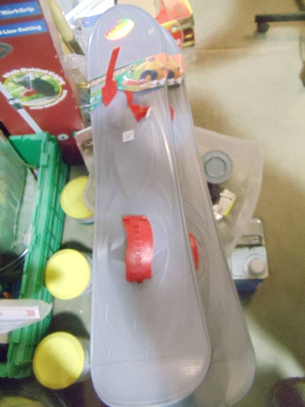 lot 105 image: NEW Qty 2 SuprHero Plastic Snow Boards Both Have 1 Broken Strap. Combine To Make 1 Good Unit or Order Spare Straps