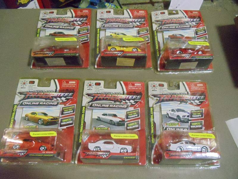 lot 181 image: NEW Qty 6 Tracksters Die Cast 164 Scale Toy Cars with Access Code for Online MMOG Gaming