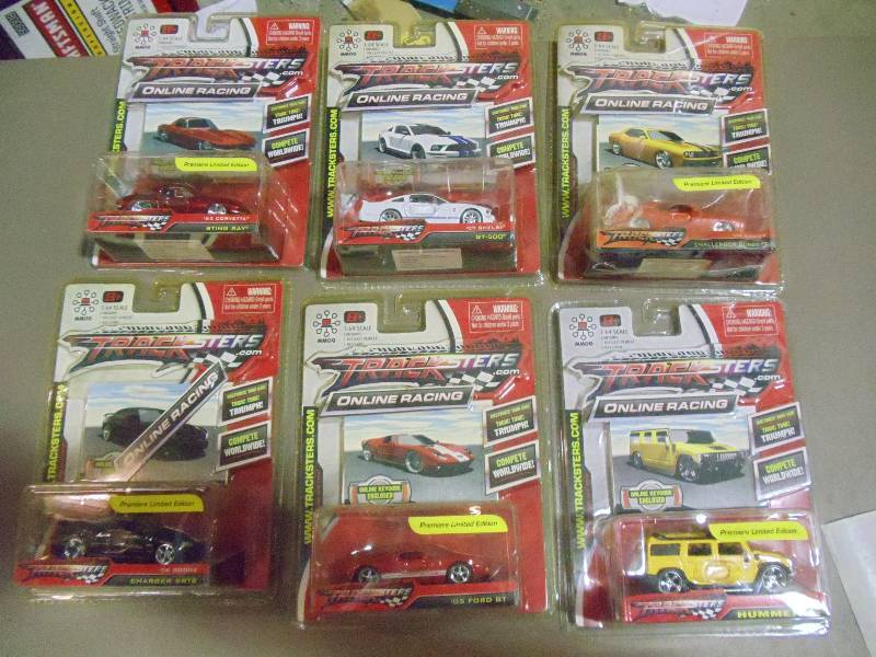 lot 182 image: NEW Qty 6 Tracksters Die Cast 164 Scale Toy Cars with Access Code for Online MMOG Gaming