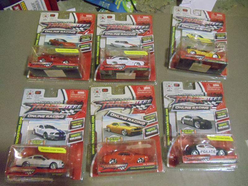 lot 183 image: NEW Qty 6 Tracksters Die Cast 164 Scale Toy Cars with Access Code for Online MMOG Gaming