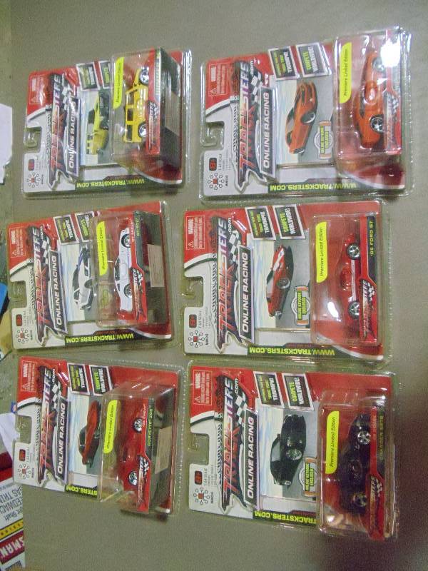 lot 184 image: NEW Qty 6 Tracksters Die Cast 164 Scale Toy Cars with Access Code for Online MMOG Gaming