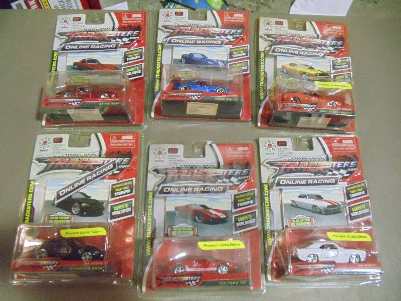 lot 185 image: NEW Qty 6 Tracksters Die Cast 164 Scale Toy Cars with Access Code for Online MMOG Gaming