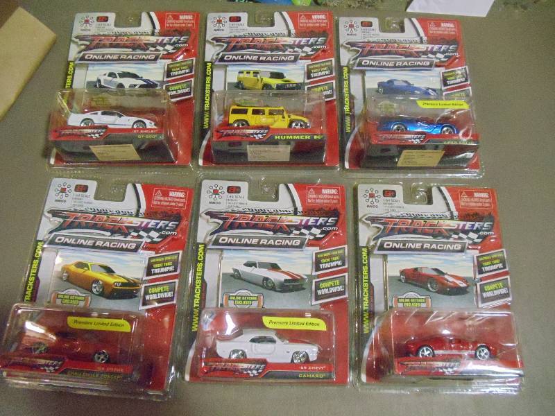 lot 186 image: NEW Qty 6 Tracksters Die Cast 164 Scale Toy Cars with Access Code for Online MMOG Gaming