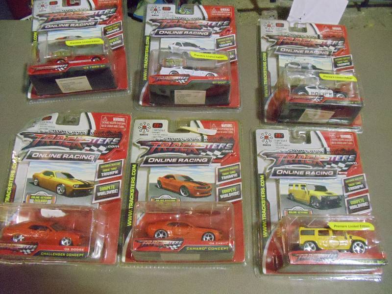 lot 188 image: NEW Qty 6 Tracksters Die Cast 164 Scale Toy Cars with Access Code for Online MMOG Gaming