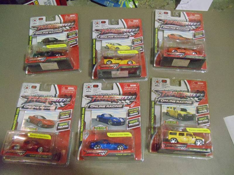 lot 190 image: NEW Qty 6 Tracksters Die Cast 164 Scale Toy Cars with Access Code for Online MMOG Gaming