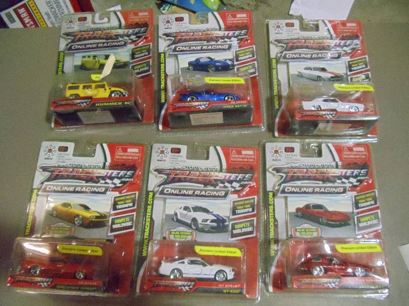 lot 191 image: NEW Qty 6 Tracksters Die Cast 164 Scale Toy Cars with Access Code for Online MMOG Gaming
