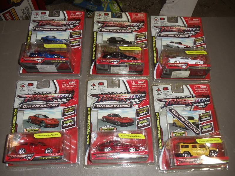 lot 192 image: NEW Qty 6 Tracksters Die Cast 164 Scale Toy Cars with Access Code for Online MMOG Gaming