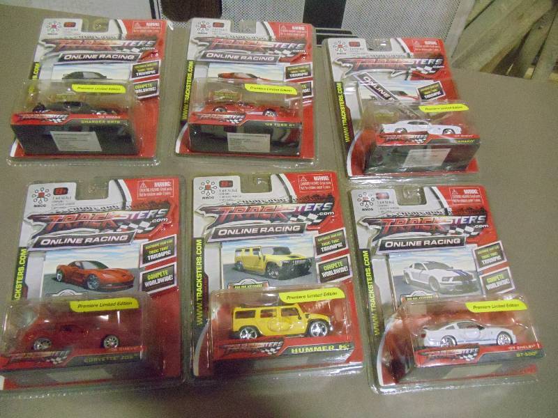 lot 213 image: NEW Qty 6 Tracksters Die Cast 164 Scale Toy Cars with Access Code for Online MMOG Gaming