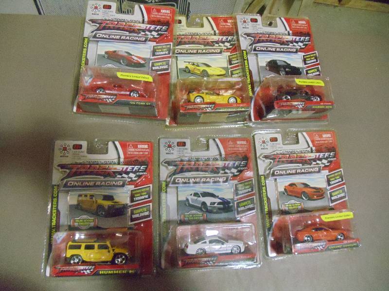 lot 214 image: NEW Qty 6 Tracksters Die Cast 164 Scale Toy Cars with Access Code for Online MMOG Gaming
