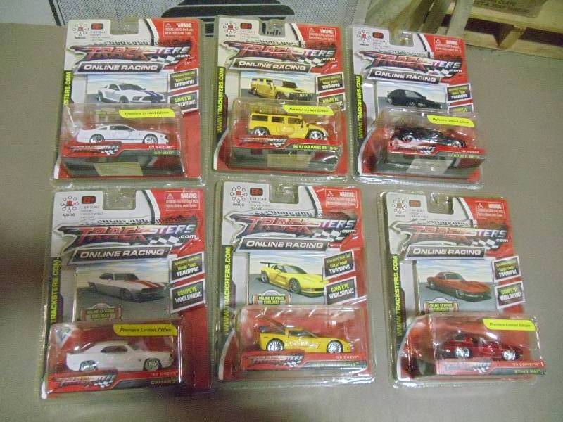 lot 215 image: NEW Qty 6 Tracksters Die Cast 164 Scale Toy Cars with Access Code for Online MMOG Gaming