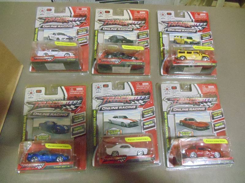 lot 216 image: NEW Qty 6 Tracksters Die Cast 164 Scale Toy Cars with Access Code for Online MMOG Gaming