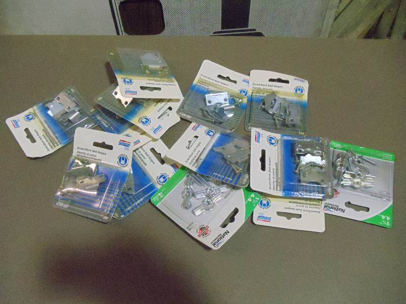 lot 306 image: NEW Approx Qty 20 Packages of 4 ea Storm SashScreen hangers and Turn Buttons