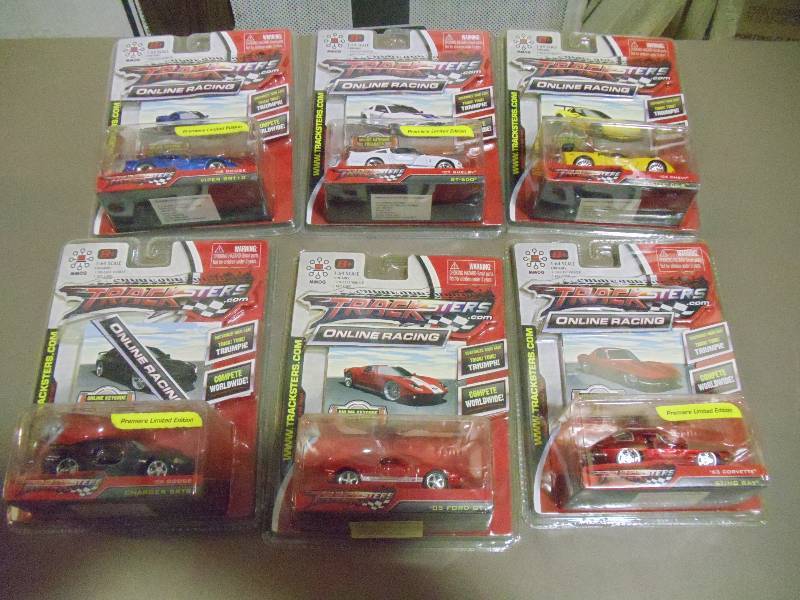 lot 315 image: NEW Qty 6 Tracksters Die Cast 164 Scale Toy Cars with Access Code for Online MMOG Gaming