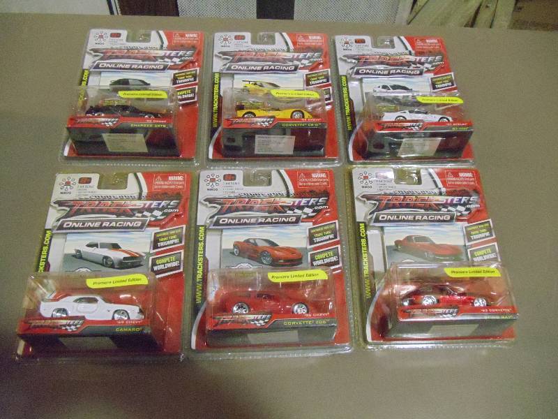 lot 316 image: NEW Qty 6 Tracksters Die Cast 164 Scale Toy Cars with Access Code for Online MMOG Gaming