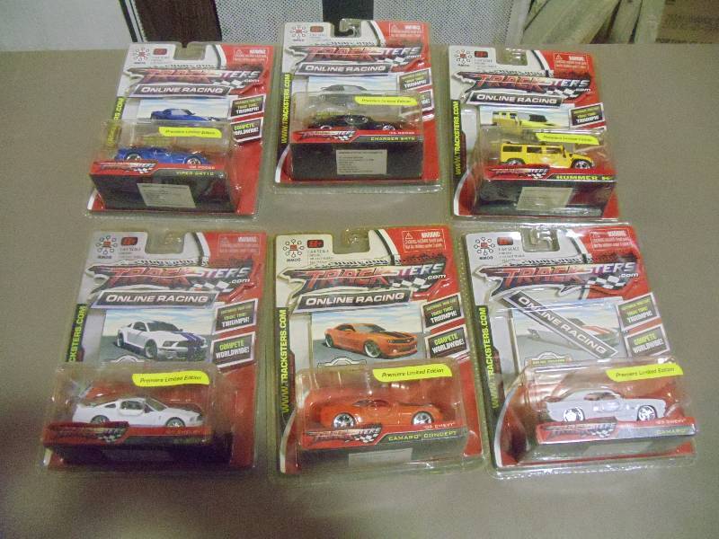 lot 317 image: NEW Qty 6 Tracksters Die Cast 164 Scale Toy Cars with Access Code for Online MMOG Gaming