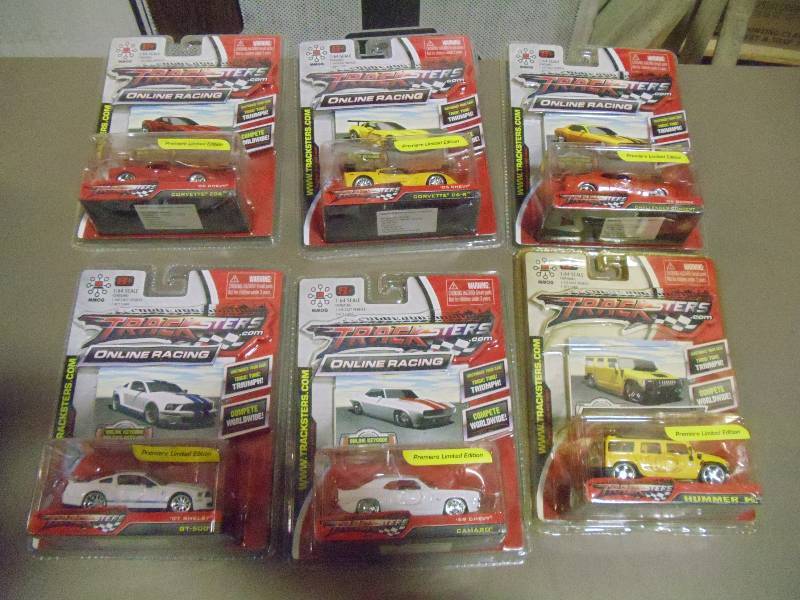 lot 320 image: NEW Qty 6 Tracksters Die Cast 164 Scale Toy Cars with Access Code for Online MMOG Gaming