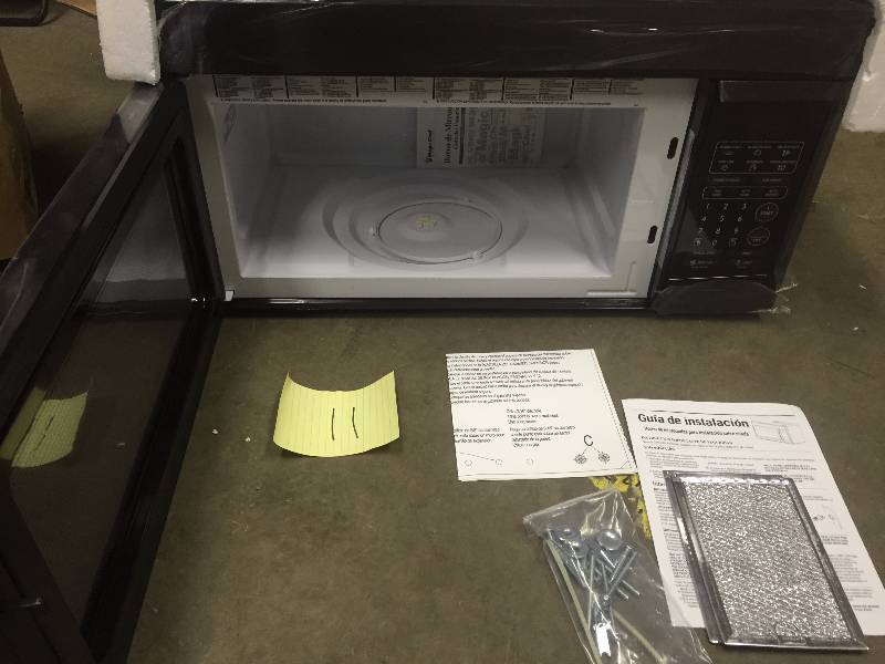 lot 11 image: Magic Chef 1.6 cu. ft. Over the Range Microwave in Black New