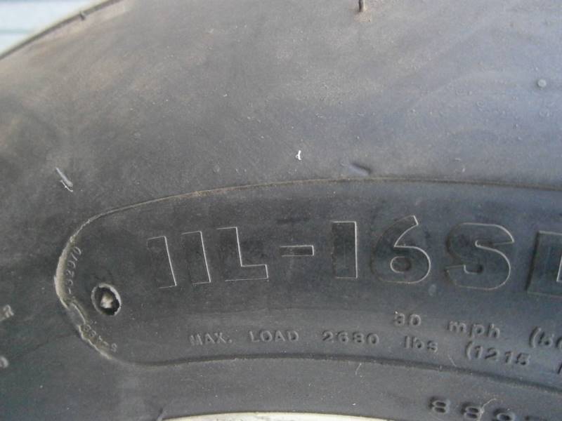 lot 2 image: 11L-16 Implement Tires & Wheels