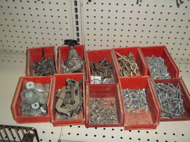 lot 7 image: lot of 10 plastic bin with assorted hardware (screws, drawer handles ,eye bolts)
