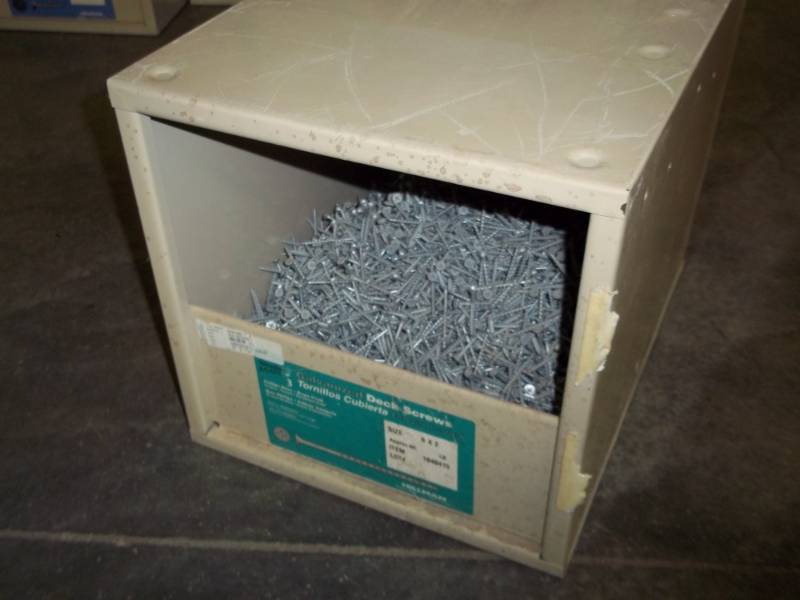 lot 81 image: metal storage box with 2 deck screws 45lbs total weight with box