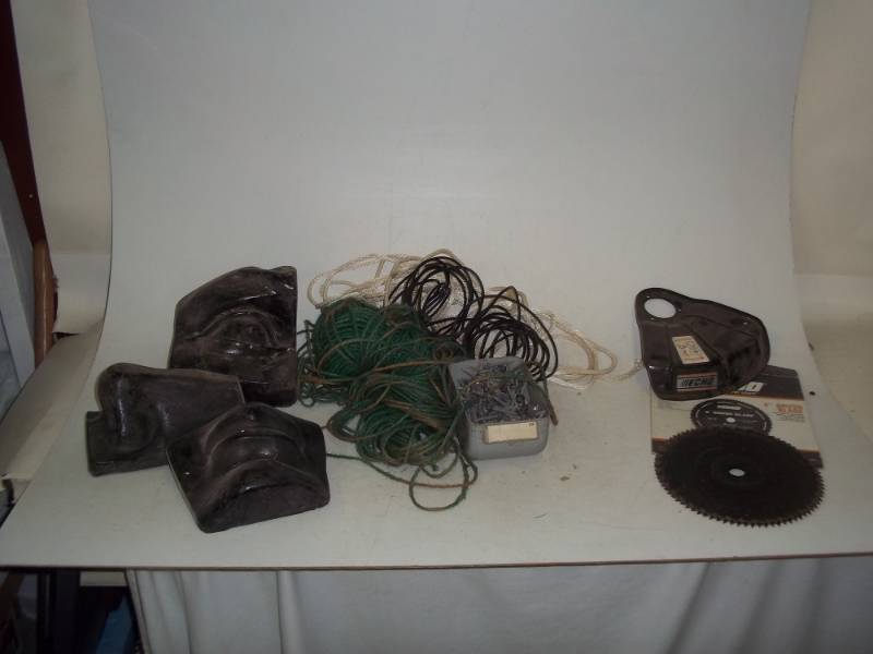 lot 192 image: spring trimmer 2 blades and guard, assorted twine & rope, incomplete Easter island figure, container whex screws