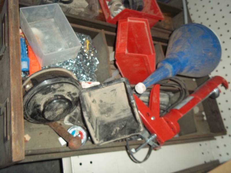lot 254 image: steel drawer wcalking gun, weed eater spring head, chain, air pressure gauge, funnel