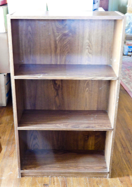 lot 27 image: veneer bookshelf 40.5 tall x 24 wide x 10 deep.