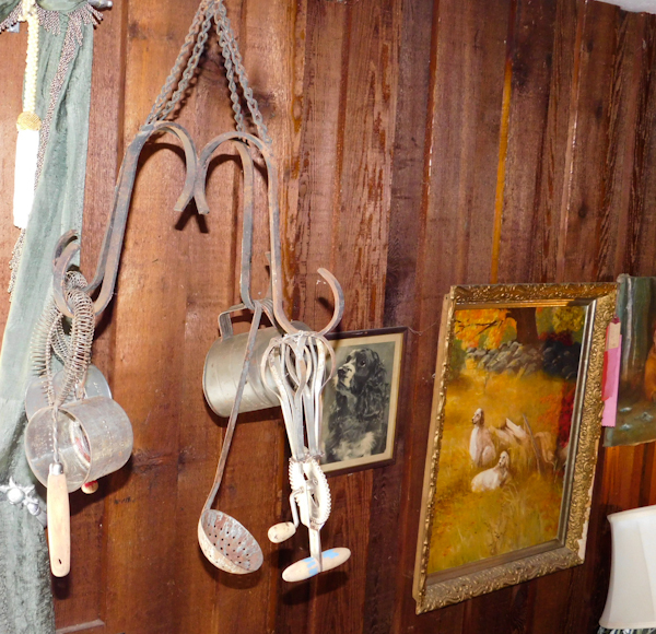 lot 45 image: cast iron metal hanger with vintage kitchen utensils