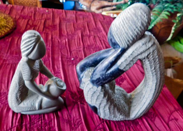 lot 110 image: African man and woman statues