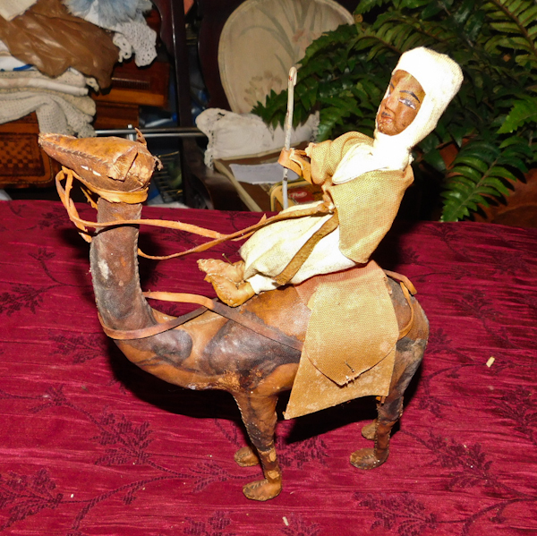 lot 127 image: Leather middle eastern man on a camel