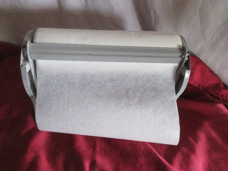 PAPER ROLL HOLDER AND CUTTER
