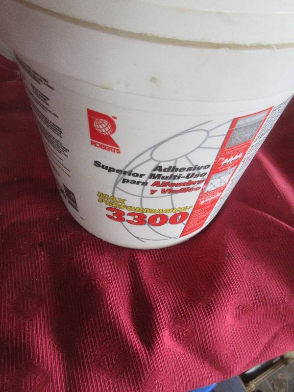 FULL PAIL  OF VYNAL AND CARPET ADHESIVE