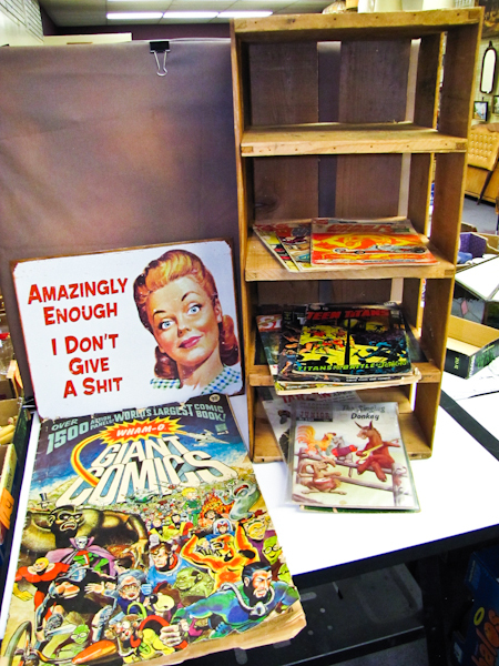 lot 60 image: vintage comic books, tin sign & wood crate shelf