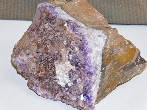 lot 116 image: 1.75 lbs Canadian Amethyst cluster with red hematite-rich red phantoms