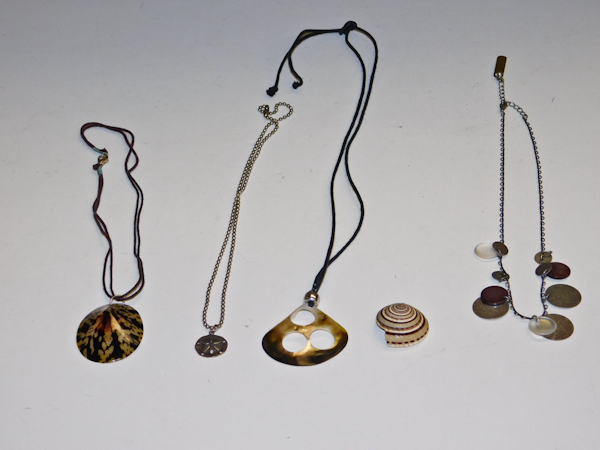 lot 158 image: 4 shell motif necklaces and 1 pendant
