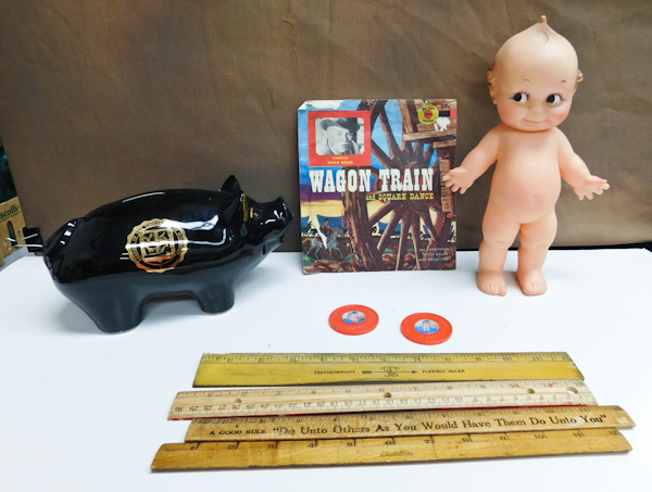 lot 173 image: Kewpie doll, piggy bank, Wagon Train record vintage rulers