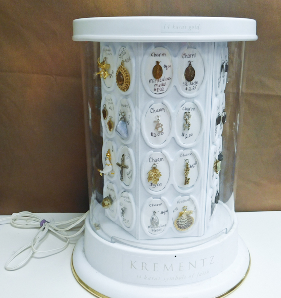 lot 179 image: display case with misc charms pendants inside all included